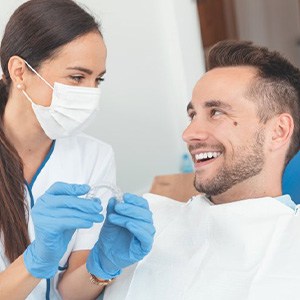 Dentist discussing clear aligners with patient