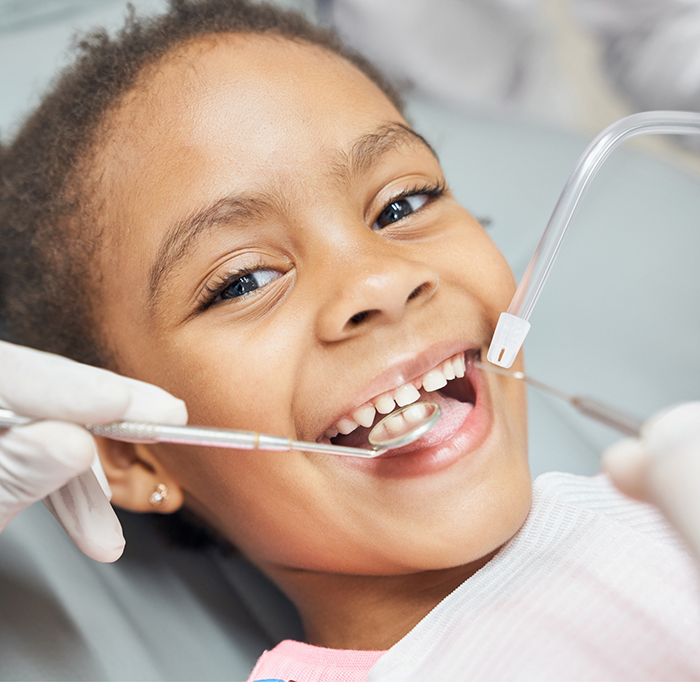 Little girl having teeth examined by childrens dentist in Idaho Falls