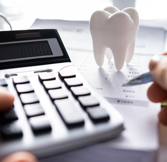 Patient in Idaho Falls budgeting for dental implants