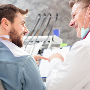 Dental implants patient in Idaho Falls talking to dentist