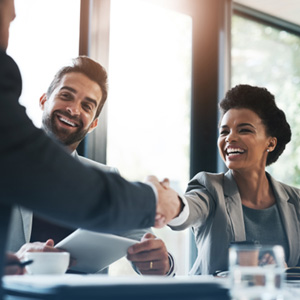 Patient in Idaho Falls smiling with dental implants at work